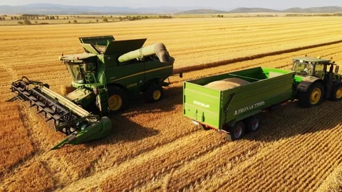 Combine Harvester Unloading Crops into a Container Transport Wave Smile Summer 스톡 동영상 274144033
