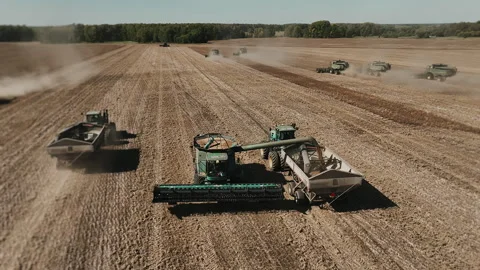Combine Harvester Unloading Grain During Large Scale Harvest. Stock Footage 346798611