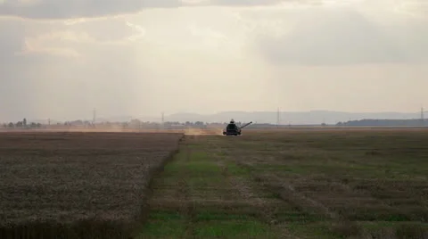 Combine harvesting grain Stock Footage 26234672