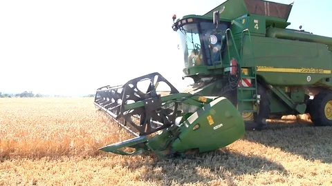 Combine harvesting grain Stock Footage 88884497