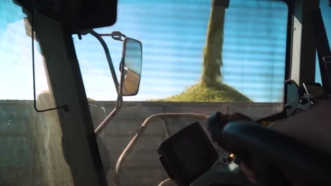 A combine harvests a crop of corn. Unloading corn. cab combine. Stock Footage 249891110