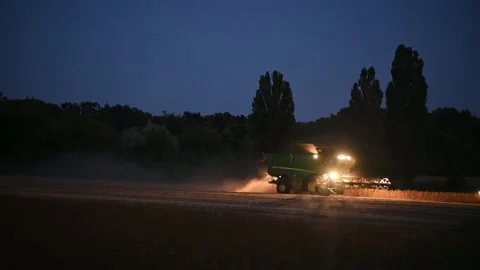 The combine harvests at night. Stock Footage 200969271