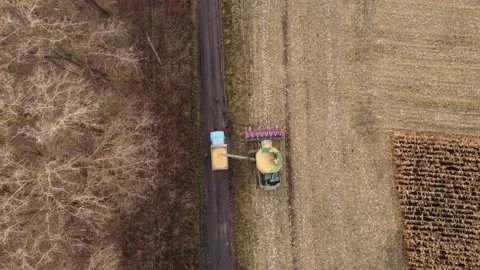 The combine pours grain Stock Footage 165780797