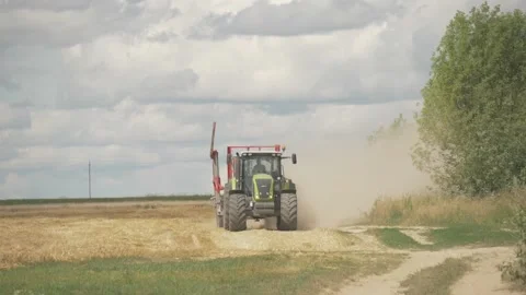 Combine rides through the field Stock Footage 141743642