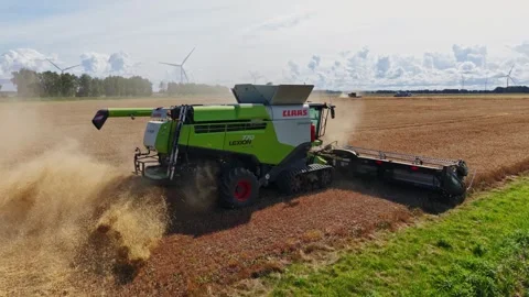 Combine Throws Chaff In Slow Motion - Dramatic Golden Harvest In Sunlight Stock Footage 347356211