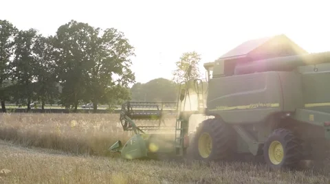 Combine Working in Dusty Field Stock Footage 52123553
