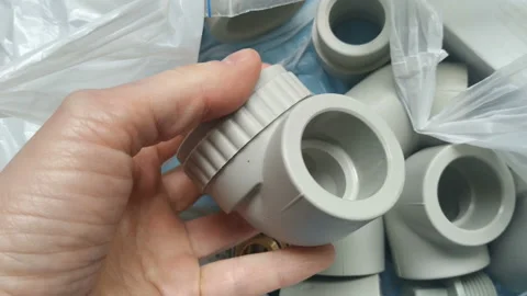 Combined angle fitting made of plastic, brass with thermal and threaded connecti Stock Footage 130882379