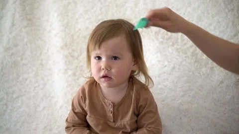 Combing Baby’s Hair. Stock Footage 237431706