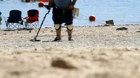 Combing the beach Stock Footage 811141