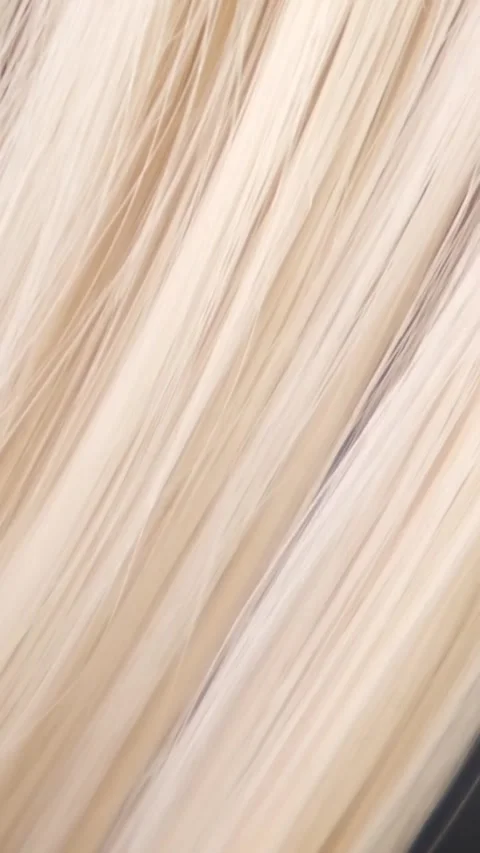 Combing blond hair with a comb close-up Stock-Footage 321196093
