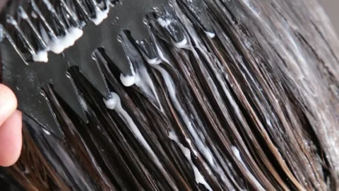 Combing hair  and applying a mask Stock-Footage 330172018