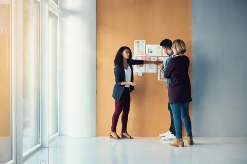 Combining their mental power. a group of colleagues having a brainstorming Stock Photos