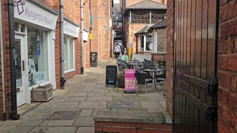Comble street view with people walking pass Stock Footage 303782277