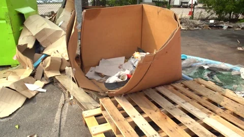 Combustible waste materials abandoned behind a commercial building. Видео 244815664