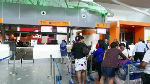 Come closer to check-in counter queue, Malaysian woman ahead Stock Footage 50937450