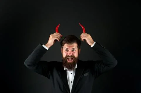 Come to hell. he is devil in business. businessman has red pepper horns Stock Photos