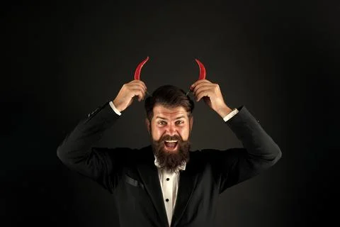 Come to hell. he is devil in business. businessman has red pepper horns Stock Photos