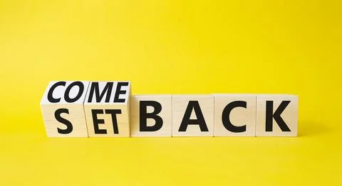 Comeback and setback symbol. Turned cubes with words setback and comeback. .. Stock Photos