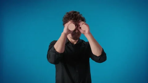 Comedian man watching two hands blinking eyes zoom optical vision motion design Stock Footage 176396604