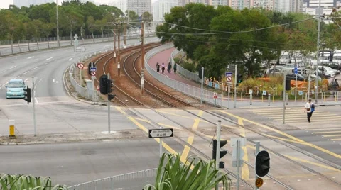 Comeng Light Rail Vehicle quickly drive away on curved rails line, overhead view Stock Footage 49993513