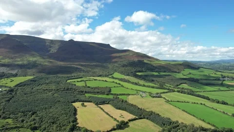 Comeragh Mountains Waterford patchwork of fields in the shadow of the Video stock 249789793