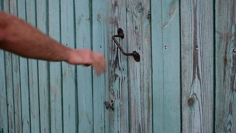 Comes out and closes the gate Stock Footage 116478552