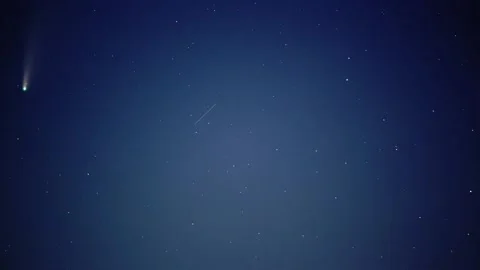 Comet in a bright starry sky with shooting stars Stock Footage 144625432