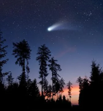 A comet in the evening sky Stock Photos
