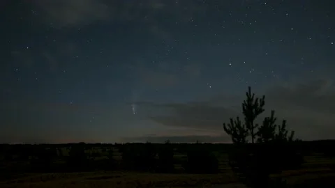 The comet moves across the night sky among the stars Stock Footage 135521692