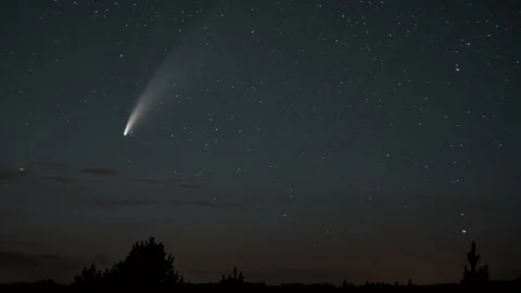 The comet moves across the night sky among the stars Stock-Footage 135665211
