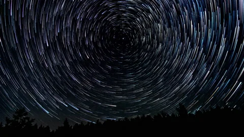Comet-shaped star trails in the night sky Stock Footage 145655707