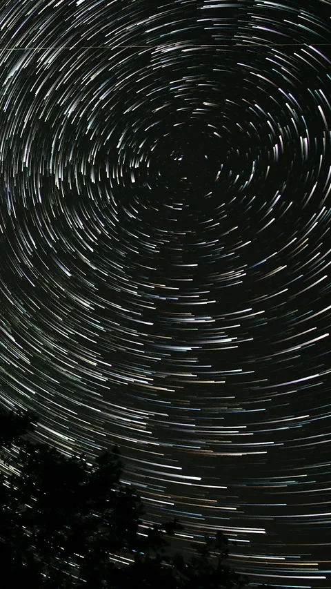Comet-shaped star trails in the night sky Stock Footage 260120465