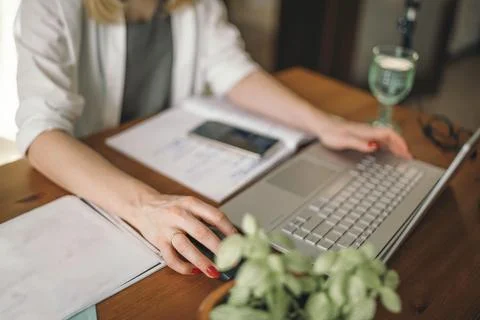 Comfort Meets Functionality in Home Office Setup, women's hands with a laptop Stock Photos