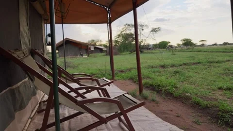 Comfortable beach or resting chairs outside of tent in safari camp in Africa Video stock 307720614