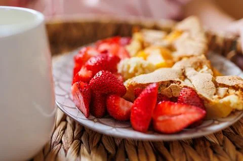 Comfortable bed, breakfast in bed. female hands hold a wooden tray with apple Stock Photos