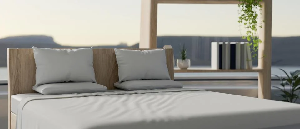 A comfortable bed with white bedsheets by a large glass window offering a s.. Stock Illustration