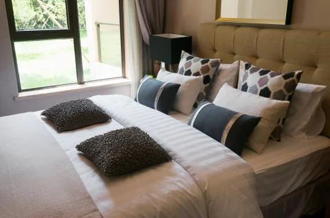 Comfortable bedroom Stock Photos