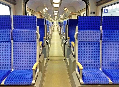 Comfortable, bright and clean interior in european modern train Stock Photos