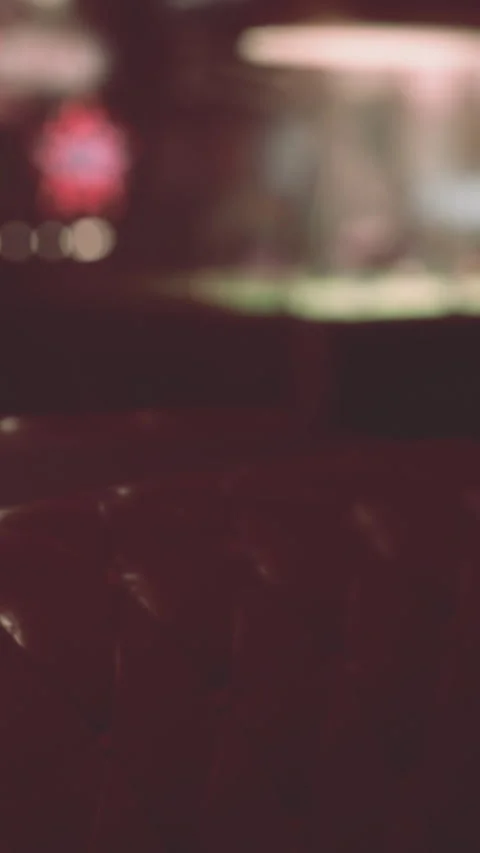 Comfortable chair in an empty cafe with a blurry fish tank in the background Stock Footage 337994032