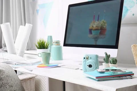 Comfortable designer's workplace with computer and digital camera in studio 스톡 사진