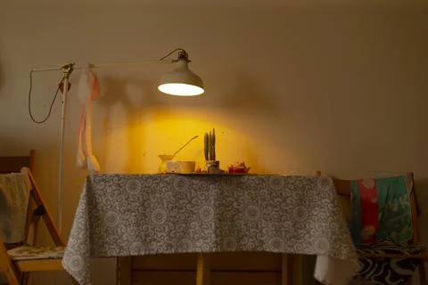 Comfortable dining corner with soft lighting and simple decor Stock Photos