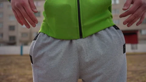 Comfortable grey sweatpants in outdoor setting, people dressed in gray Stock Footage 330605880