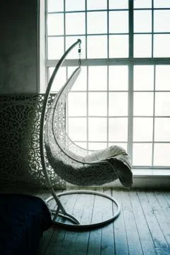 Comfortable interior with big window, elegant sofa and modern design Stock Photos