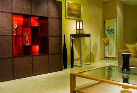Comfortable interior with a glass table in the foreground Foto stock