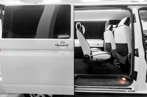 Comfortable interior of a passenger bus with soft seats Stock-Fotos