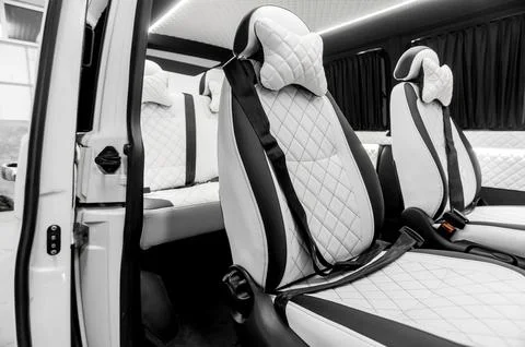 Comfortable interior of a passenger bus with soft seats Foto stock