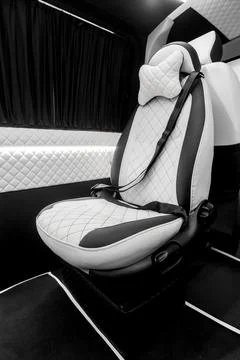 Comfortable interior of a passenger bus with soft seats Stock Photos