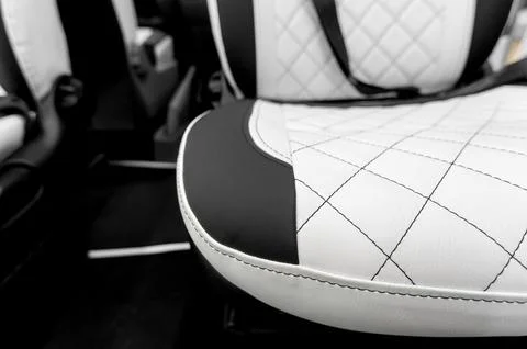 Comfortable interior of a passenger bus with soft seats Stock Photos