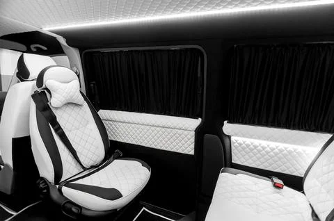 Comfortable interior of a passenger bus with soft seats Stock Photos
