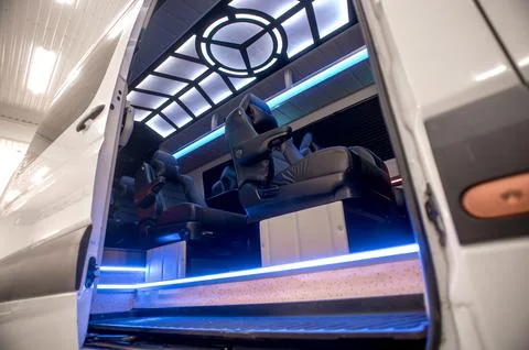 Comfortable interior of a passenger bus with soft seats Stock-Fotos